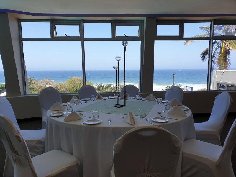 Function venue with round tables and panoramic ocean views